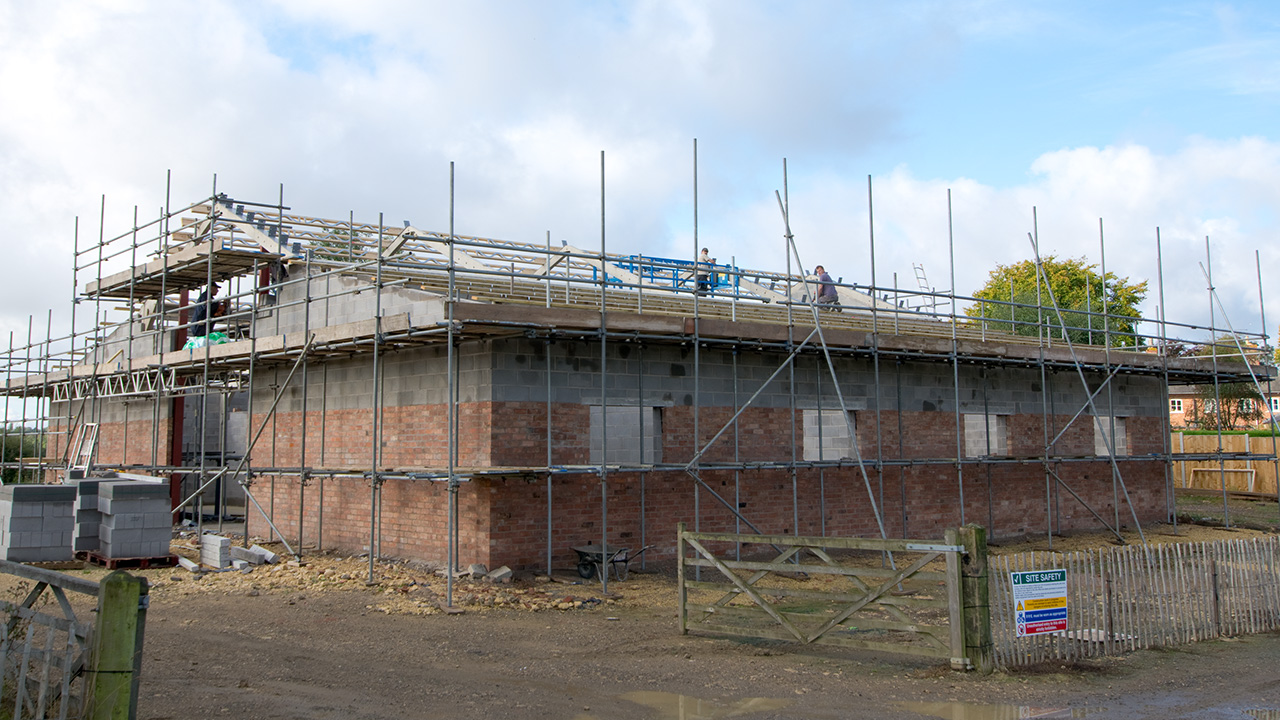 Sep 2019: Concrete floors complete, block and brickwork done, steelwork going up and roof beams being fitted!